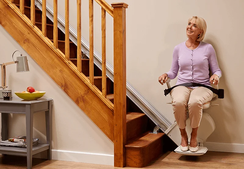woman sitting on Acorn Straight Stairlift seat